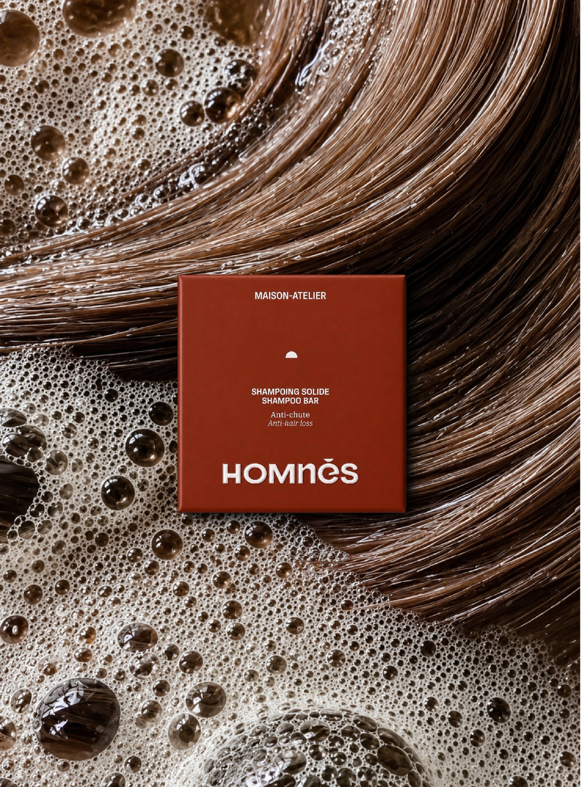Shampoing Anti-chute Homnès sur cheveux et mousse